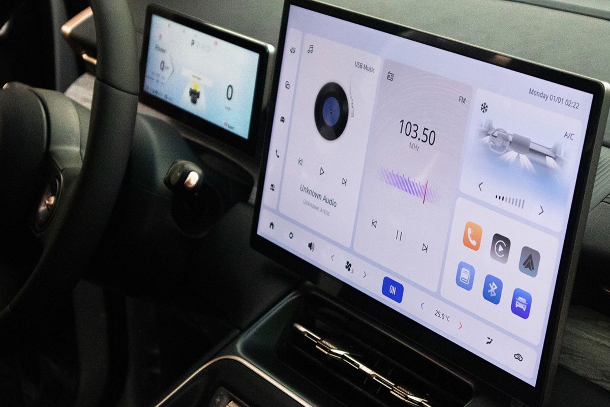 Chevrolet Captiva PHEV interior showing the touchscreen infotainment display, digital driver cluster, and cabin controls.